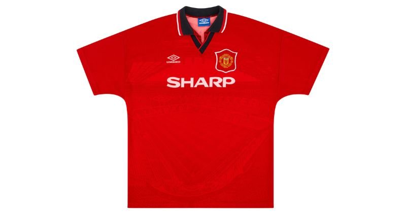 Manchester united home shirt 1994-96 with a black collar and an image of old trafford on the front
